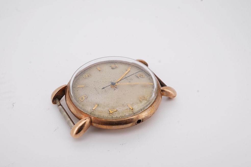 A gentleman's 1940's? 9ct gold Rolex manual wind wrist watch, with signed Super Balance movement, the inner case back numbered 4411 over 844, case diameter 34mm, no strap or winding crown. Condition - poor